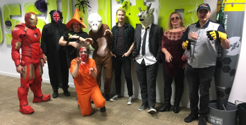 Staff pose in their Halloween costumes.